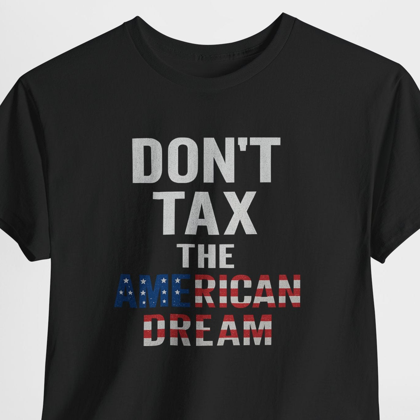 Black t-shirt with 'Don't Tax the American Dream' text on a white background