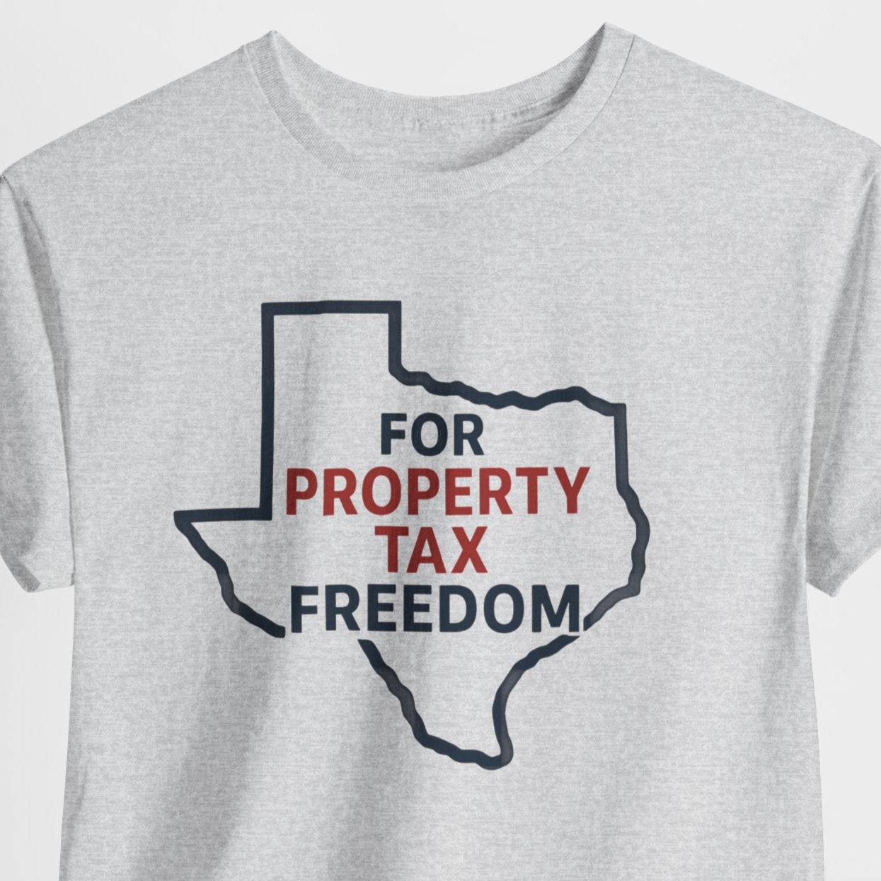 Gray t-shirt with a graphic design of Texas outline and text 'FOR PROPERTY TAX FREEDOM' on a light gray background