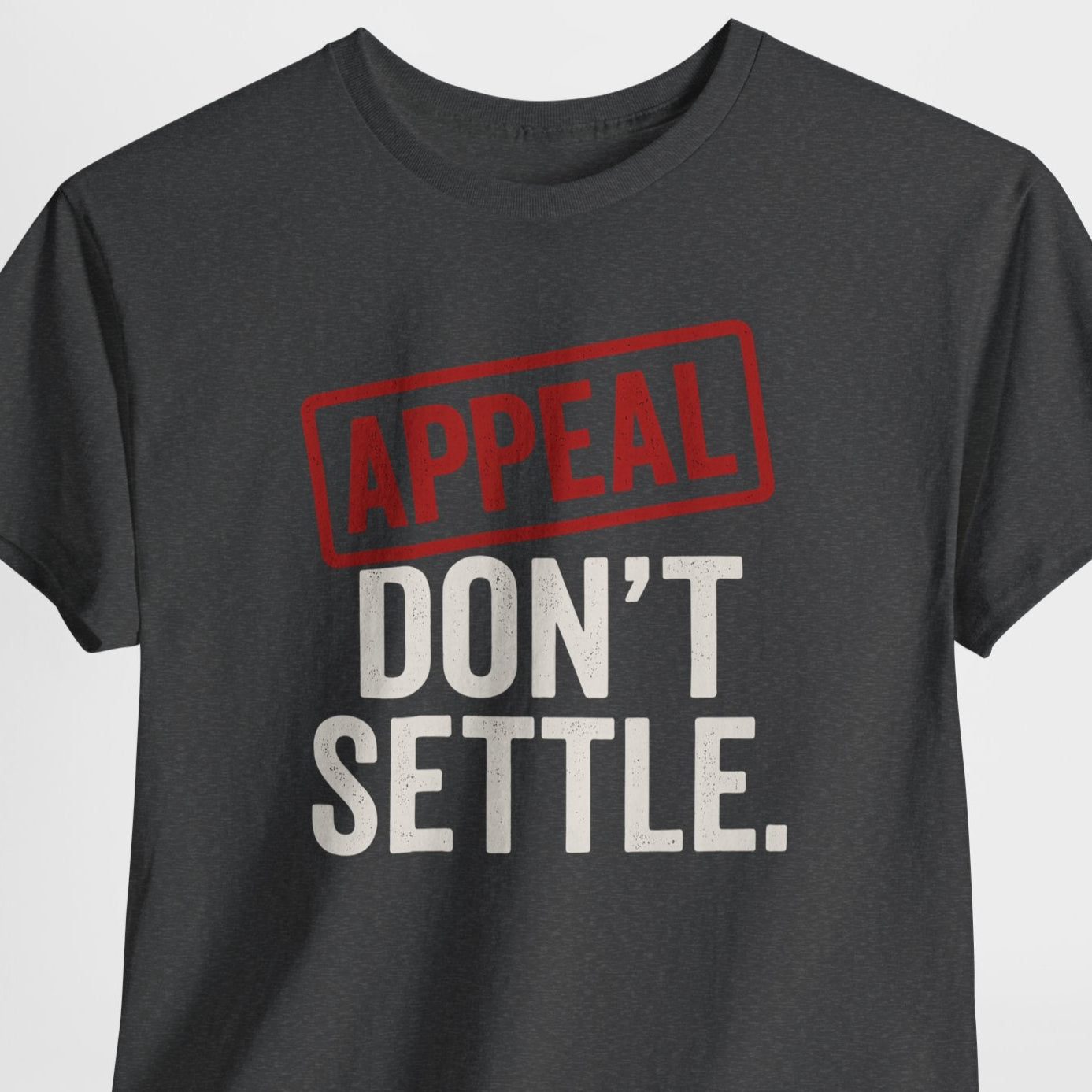 Black t-shirt with 'APPEAL DON'T SETTLE' text on a light gray background