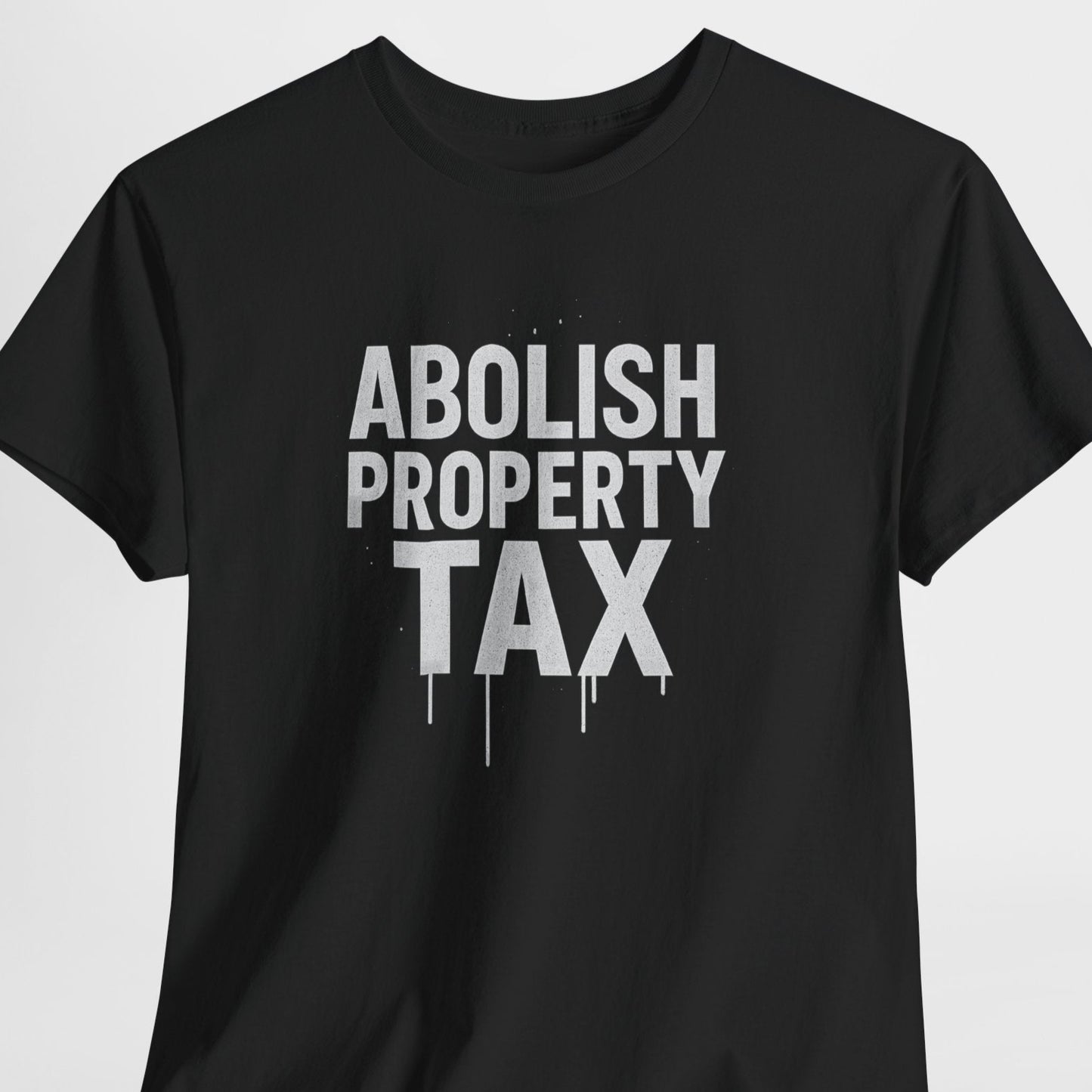 Black t-shirt with 'ABOLISH PROPERTY TAX' text on a light gray background
